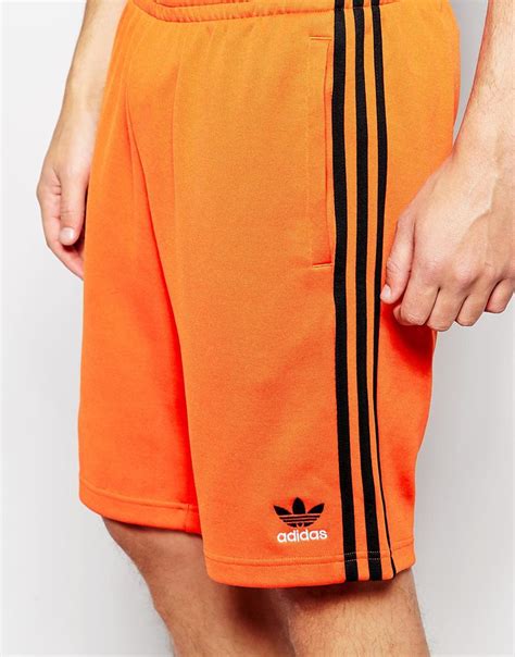 adidas orange shorts.